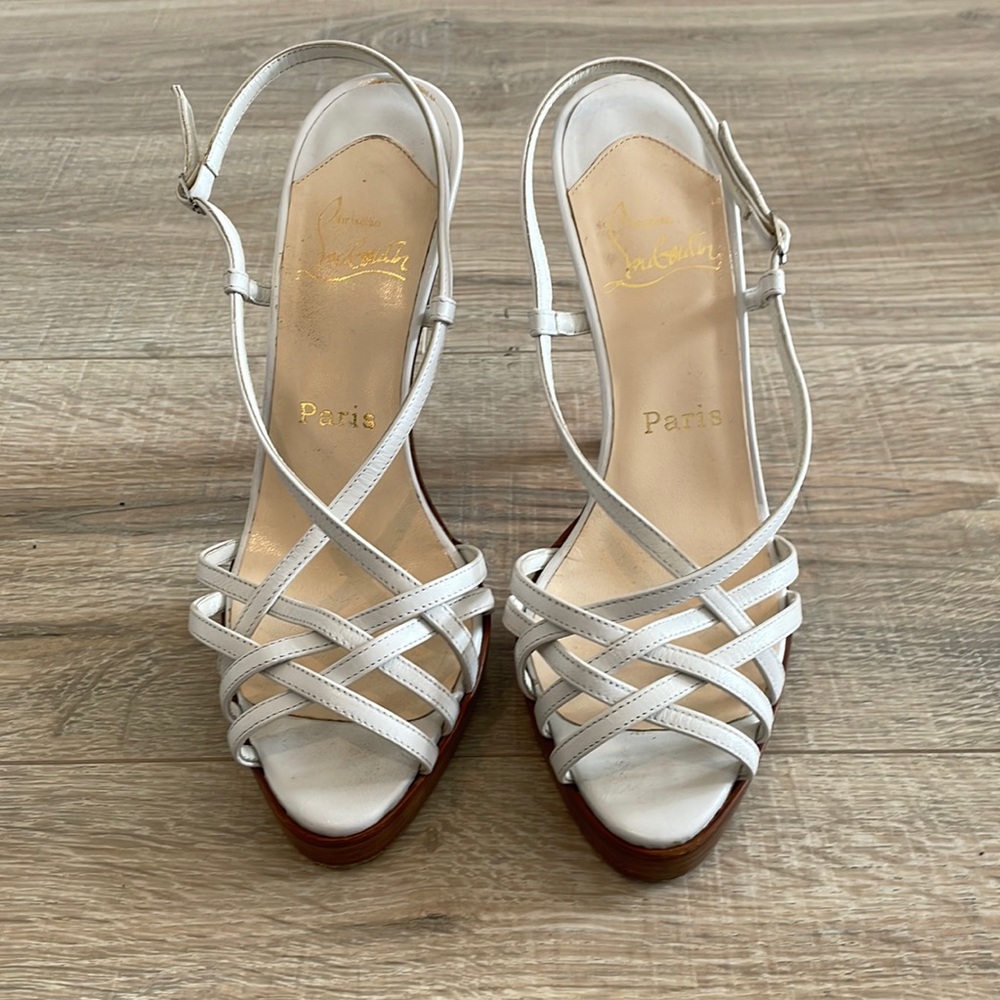 Red bottom Christian Louboutin white platforms.  Killer wedding shoes